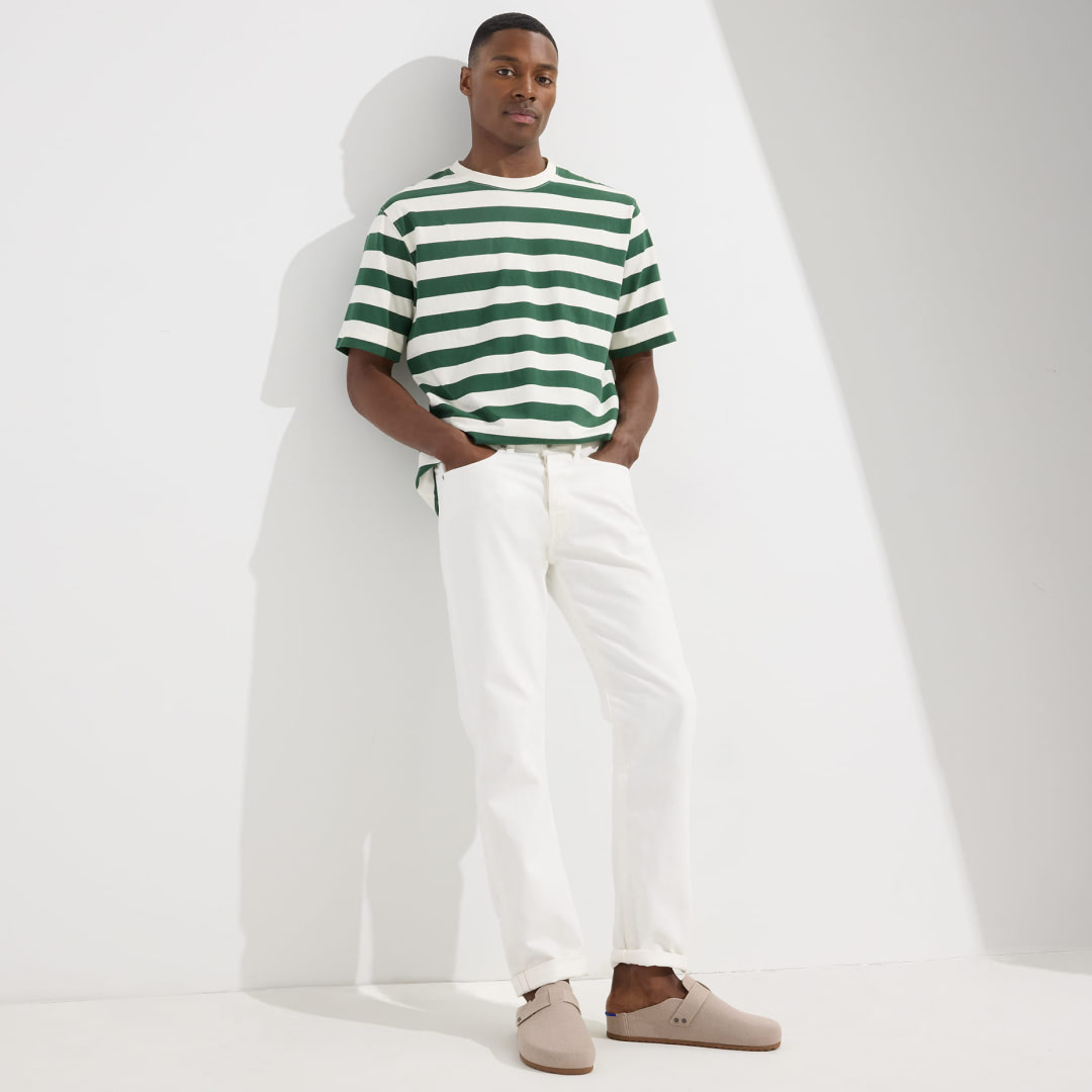 Model Stands Wearing The Men's Clog in Dove