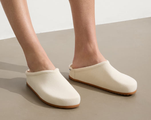 Close-up of a woman's feet wearing the casual clog in jasmine, highlighting a relaxed and casual footwear choice.  